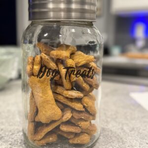 Dog treats pictured in a glass dog treat jarr